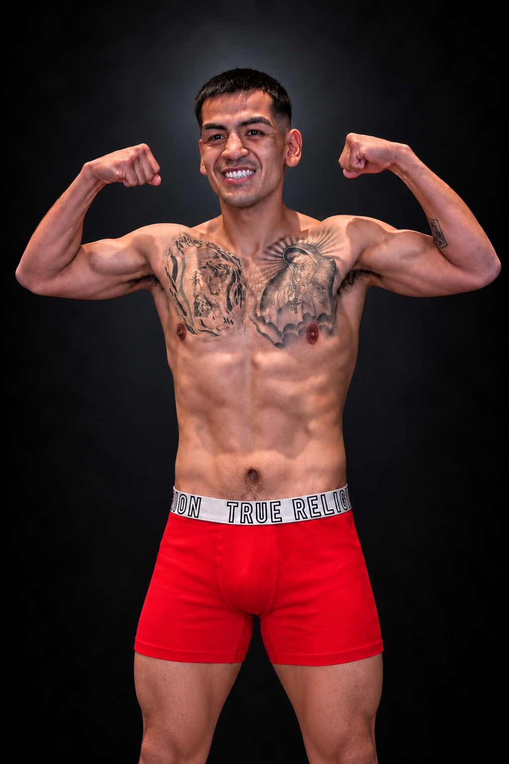 Eduardo Diaz, El Torito, flexing in a black studio boxing portrait